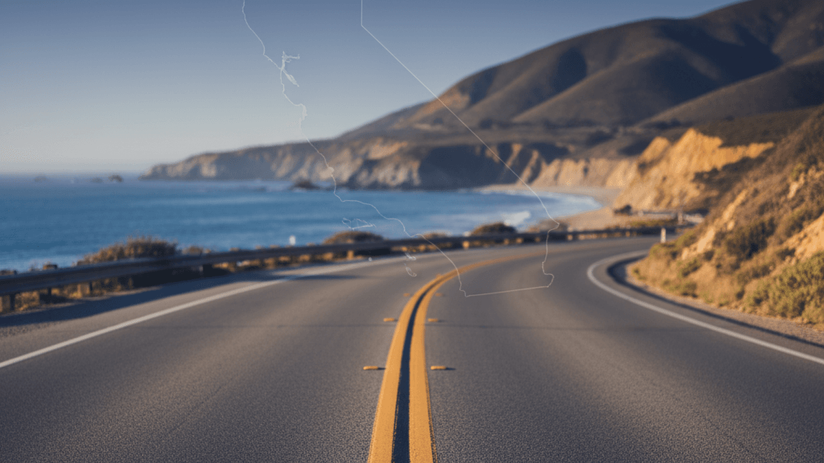 California coastal highway with a double solid yellow centerline, illustrating CVC §21460 no-passing context
